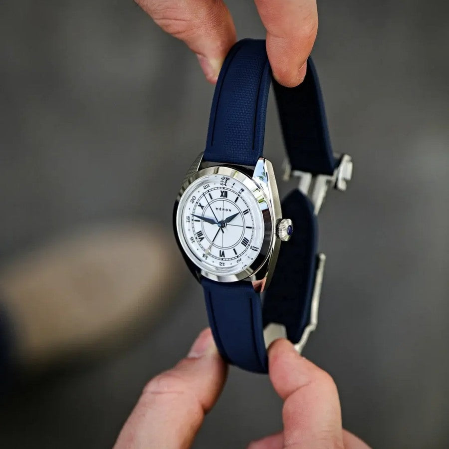 A Heron watch on a WIS blue sailcloth strap with deployant clasp