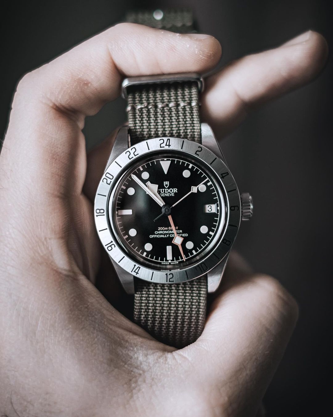 a classic field watch on a grey WIS woven nylon watch strap